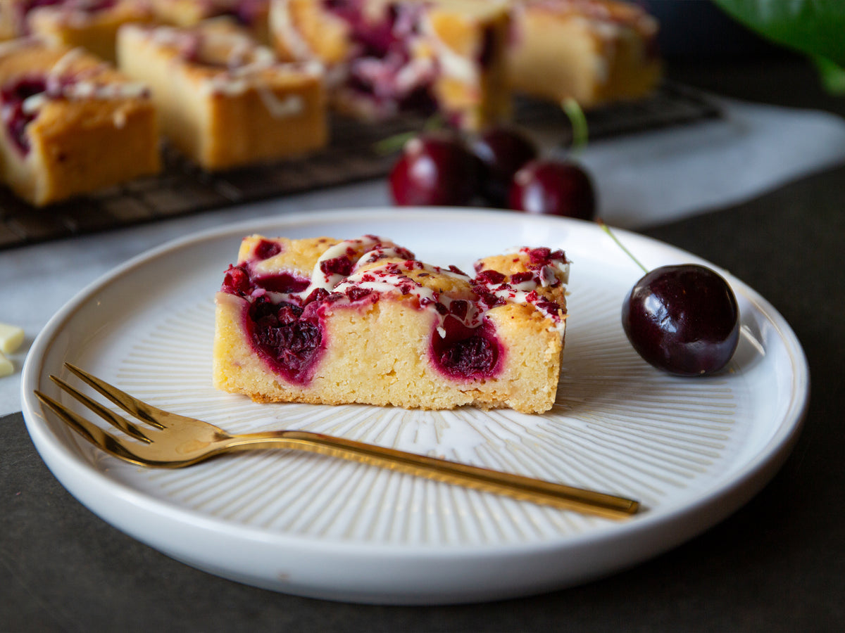 A slice of Cakesmiths Morello cherry blondie